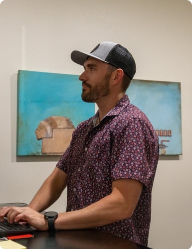 smooth fusion team member, braden mason, working at desk